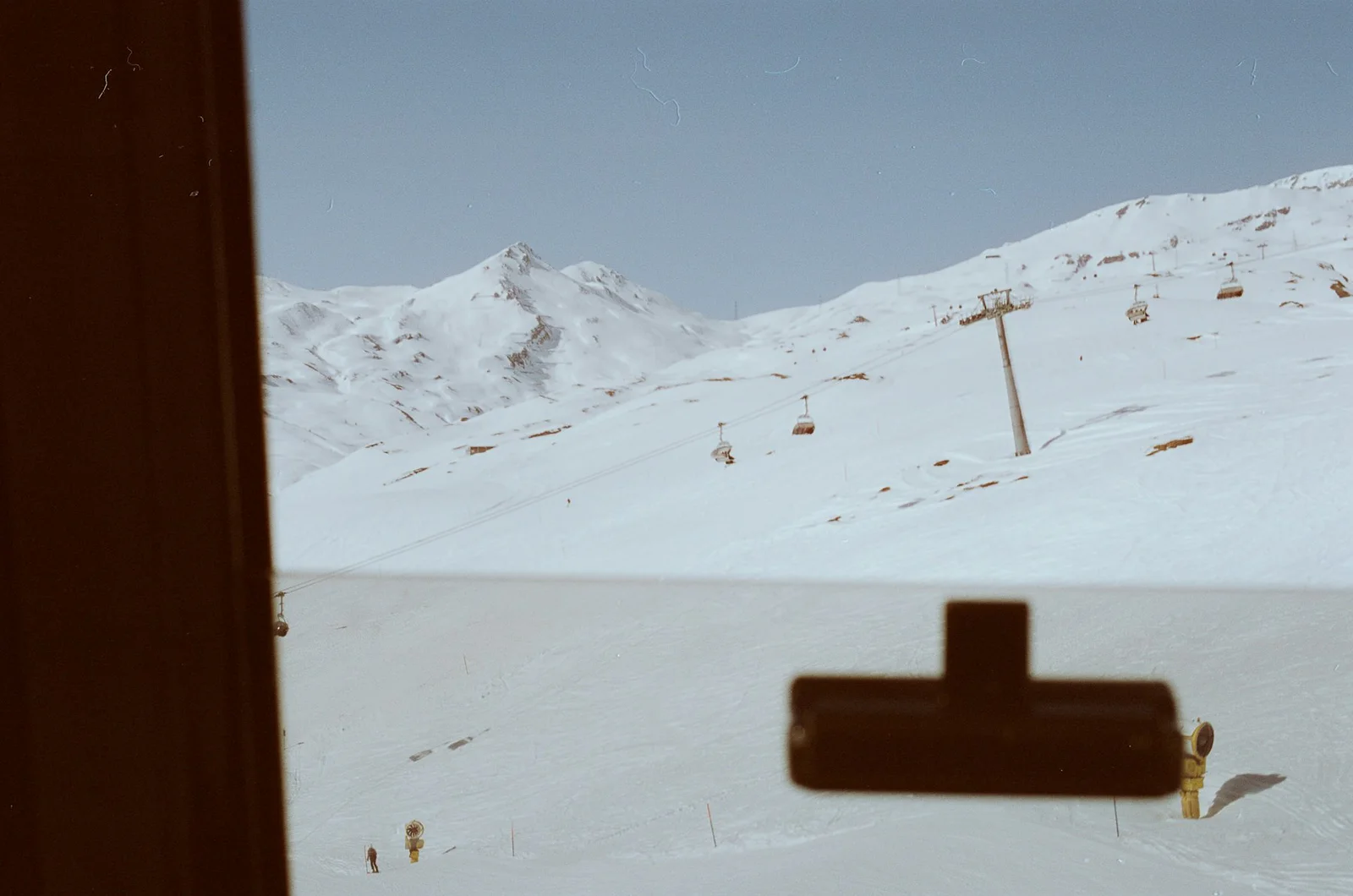 Snow-covered ski slopes and a mountain lift